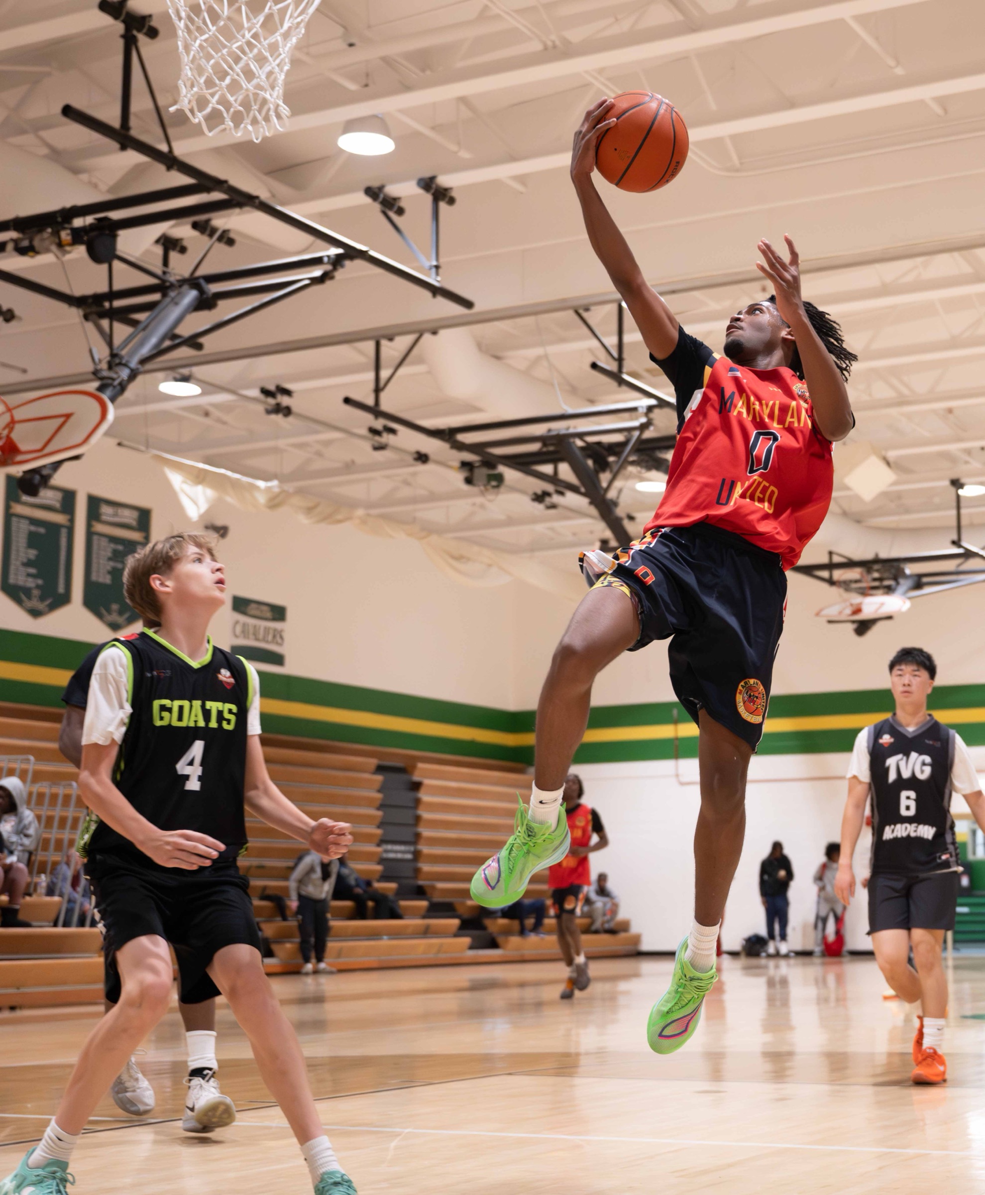 Maryland United player finishing at the rim in a game